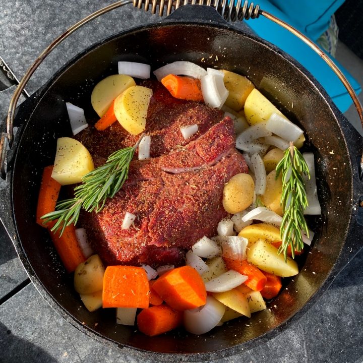 Chuck roast in Dutch oven with all the ingredients.